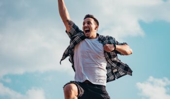 Man jumping into the air enthusiastically