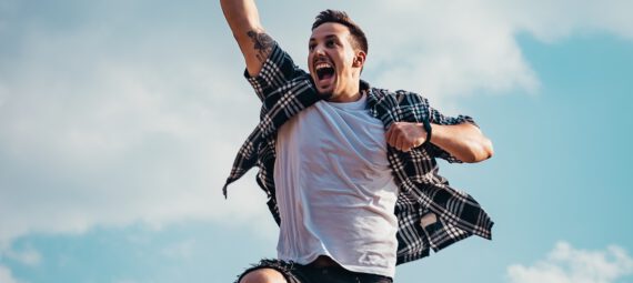 Man jumping into the air enthusiastically