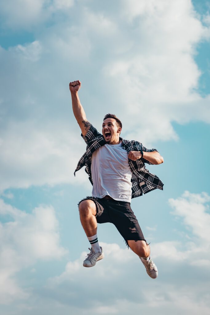 Man jumping into the air enthusiastically